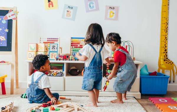3 toddlers playing with toys